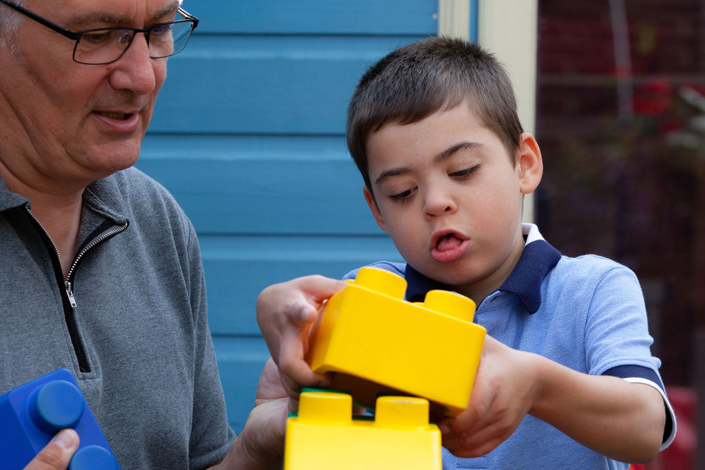 Jacob's story - Jacob puts together some yellow lego blocks