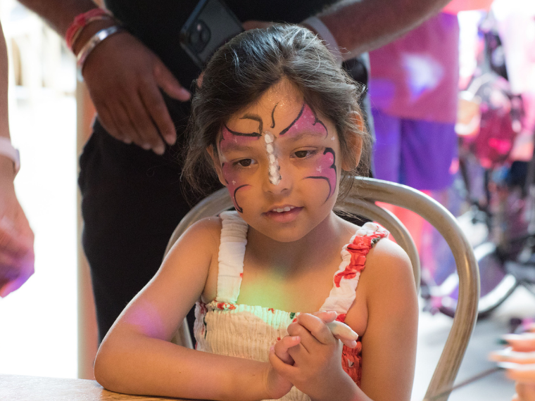 Saniyah at a party, with her face painted as a butterfly